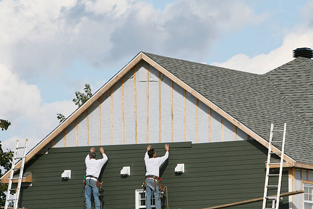 Professional Storm Damage Siding Repair technician working in Rome, IL